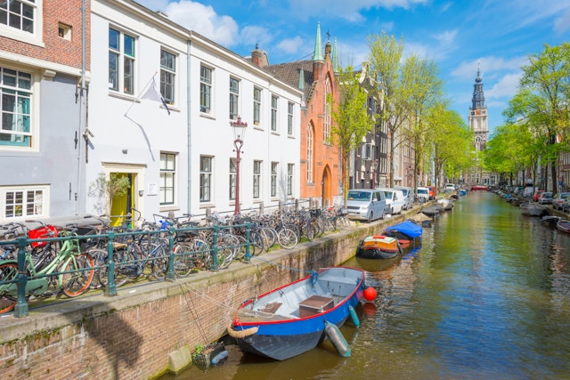 Canal in the city of Amsterdam with boats moored