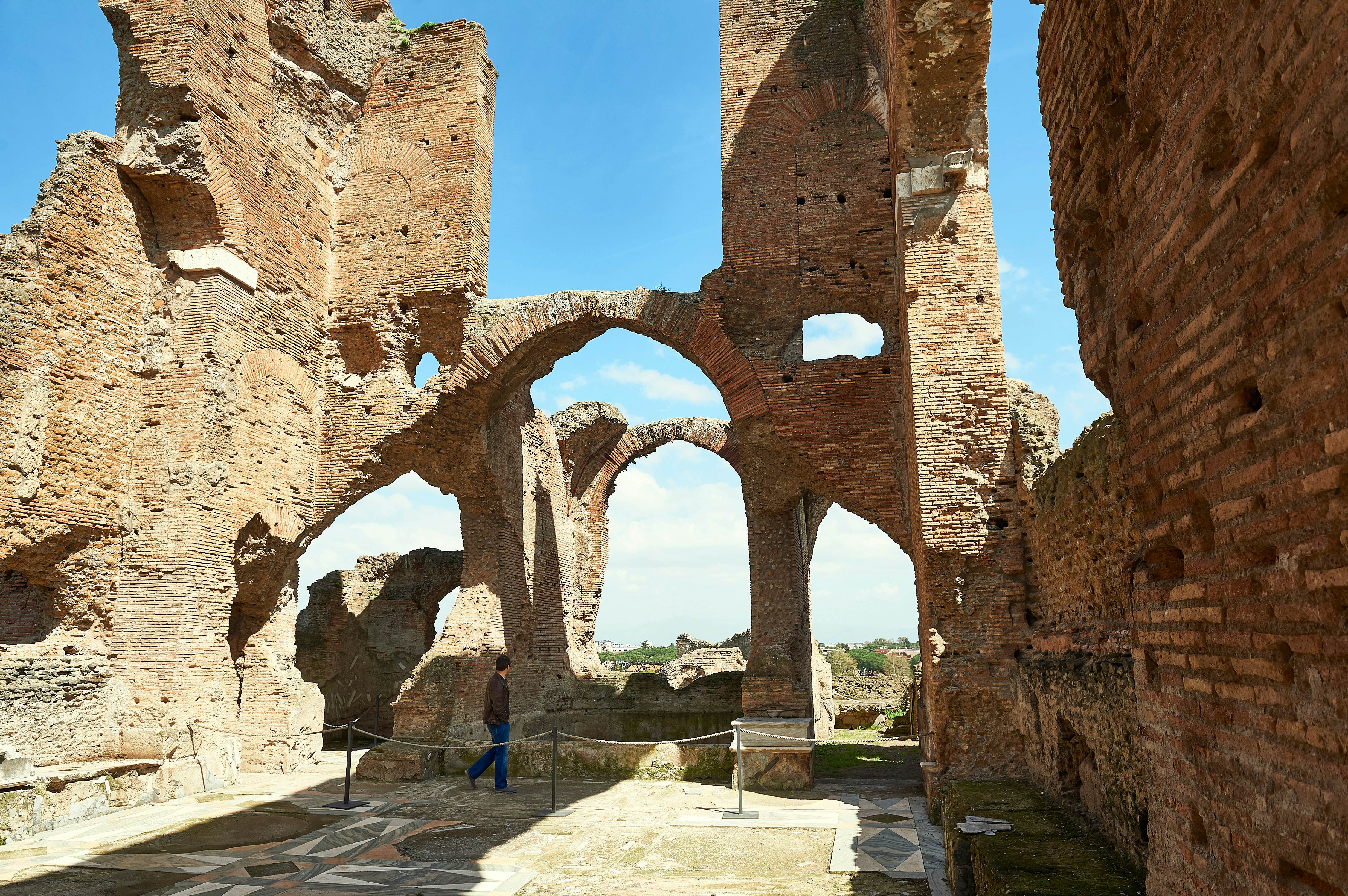 Ruins of Villa dei Quintili on the Appian Way in Rome.
1119245861
ancient, antique, antiquity, appia, archaeological area, archeology, arches, architecture, art, blue, blue sky, bricks wall, building, city, cloudy blue sky, cloudy sky, culture, europe, famous, historic, historical, history, italy, landmark, landscape, location, man, mediterranean, monument, monumental, mosaic, mosaic tiles, old, outdoor, panoramic, proportions, roman empire, rome, ruins, site, stone, structure, tourism, tourist, travel, villa dei  quintili, visited, vía apia, wall, wall texture, villa dei quintili