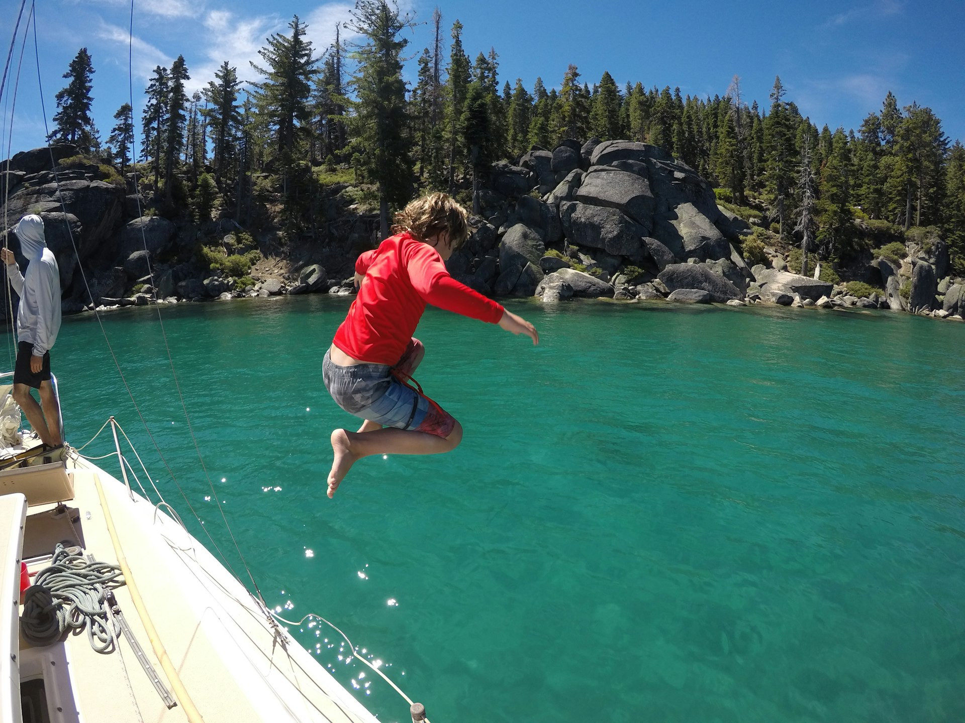 A child jumps into the water at Emerald Bay, Lake Tahoe, California, USA