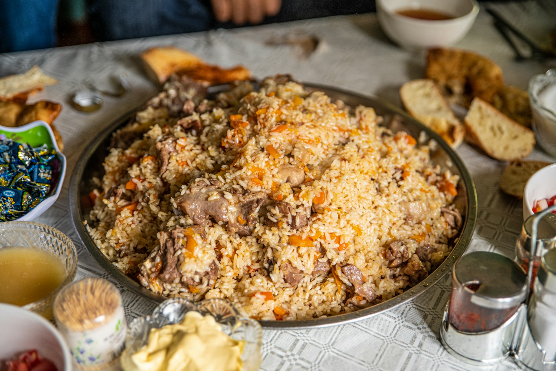 A rice dish with pieces of meat in it