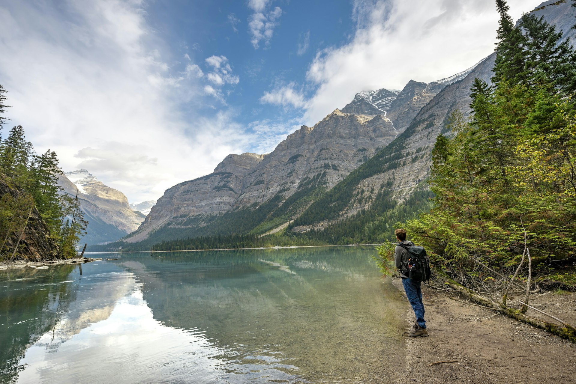Hikers on the shore of Kinney Lake, Mount Robson Provincial Park, British Columbia, Canada