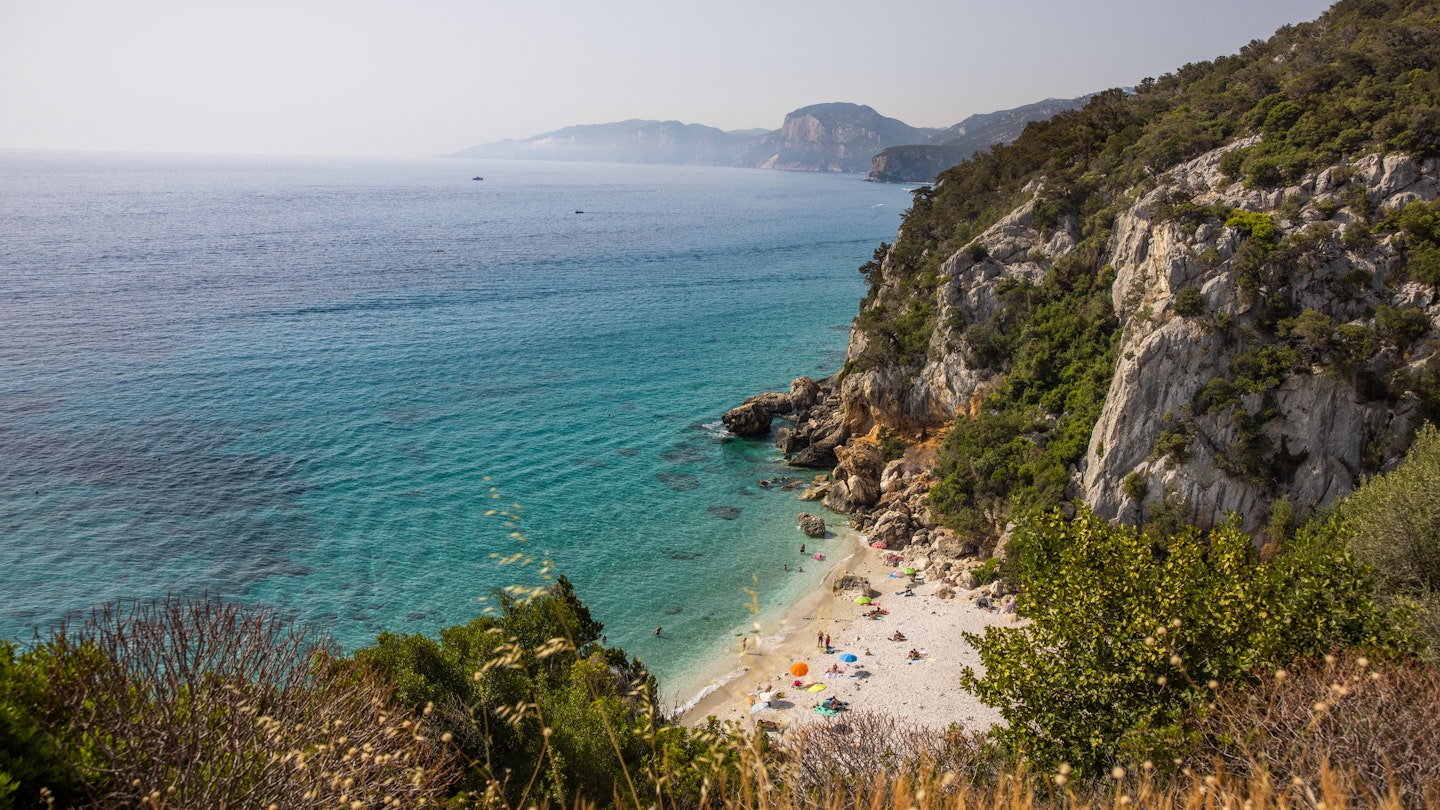 View of a small beach along the coast with a few people, Sardinia, Italy.
1361801517