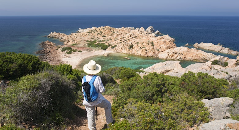 Woman admiring view over Cala Crucitta from hillside path, Caprera, Parco Nazionale dell'Arcipelago di La Maddalena, Sassari, Sardegna, Italy, Europe. Second largest of the islands in the Maddalena archipelago, Caprera lies to the north of the Gulf of Arzachena off the Galluran coast of Sardinia, Punta Crucitta being its northernmost point. Scarcely populated, the island was home to Giuseppe Garibaldi, father of Italian unification, for almost thirty years, while its unspoilt natural environment has made it a popular hiking destination. The Maddalena Archipelago National Park was established in 1994, the first such park to be created in Sardinia.
1467837197