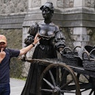 A person poses for a photograph with the iconic Molly Malone statue in Dublin's city centre after it was vandalised with black paint across it's front. The statue of the semi historical, semi-legendary figure is a popular tourist destination. Picture date: Wednesday August 16, 2023. (Photo by Brian Lawless/PA Images via Getty Images)
1602353319
