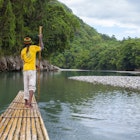 175624170
Bamboo Rafting on the Rio Grande, Jamaica - stock photo
Rio Grande is the birthplace of river rafting in Jamaica. The original use of these rafts was to transport bananas from the inland plantations to the harbour at Port Antonio. The pursuit was popularised by Errol Flynn who used to challenge his guests to moonlight rafting races along the Rio Grande.