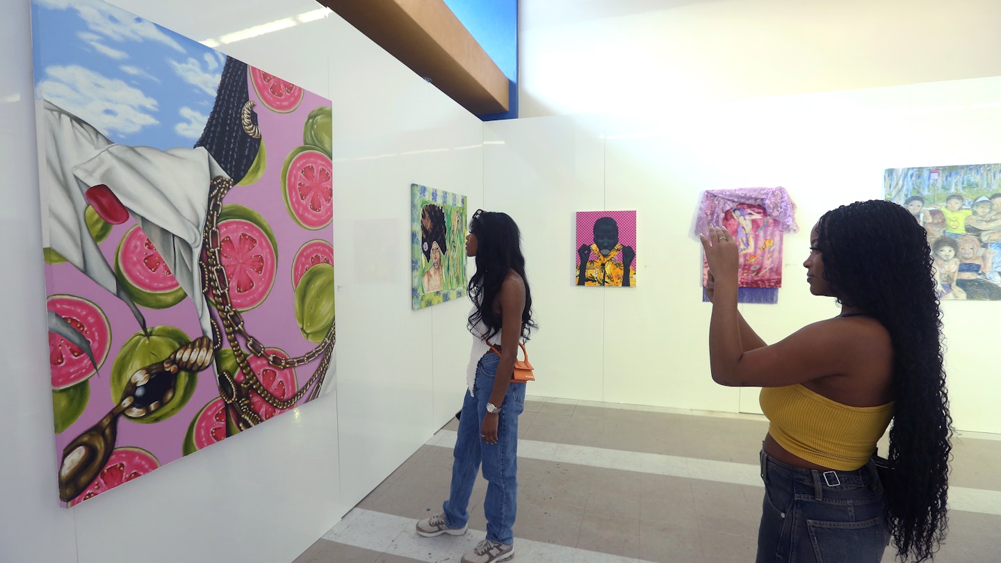 MIAMI, FLORIDA - DECEMBER 10: Guests admire an acrylic on canvas painting titled Affluence by Akila Watts of the Bahamas presented by Filo Sofi Arts Gallery at the 11th annual PRIZM Art Fair as part of Art Basel Miami Beach on December 10, 2023 in Miami, Florida. (Photo by Sean Drakes/Getty Images)
1855617110
akilah watts, prizm