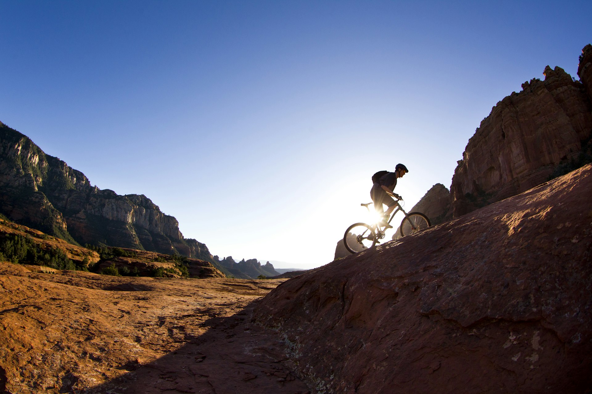 A male mountain biker rides a popular cross-country trail in Sedona, Arizona, USA