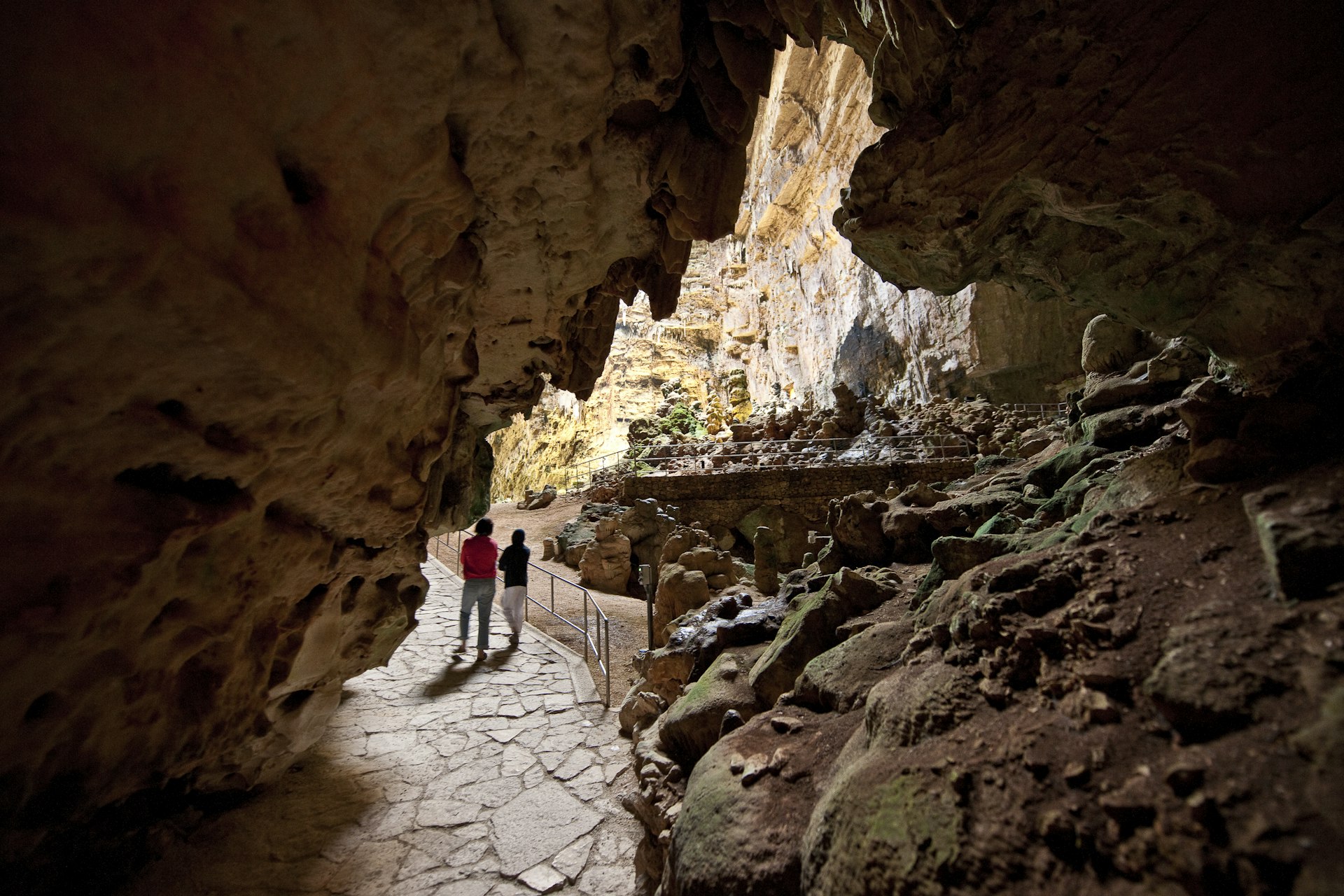 People walk through Castellana Grotto in Puglia, Italy