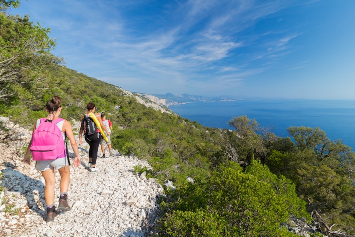 Group of three people doing trekking in the track called "Ispuligi de nie" (inspuligidenie). The road leads to a beautiful beach called "Cala Mariolu" which is an important tourist destination of Sardinia. Peolpe walking and doing sport in an uncontaminated natural landscape. Baunei, Ogliastra, Sardinia, Italy.
538833044
rear view