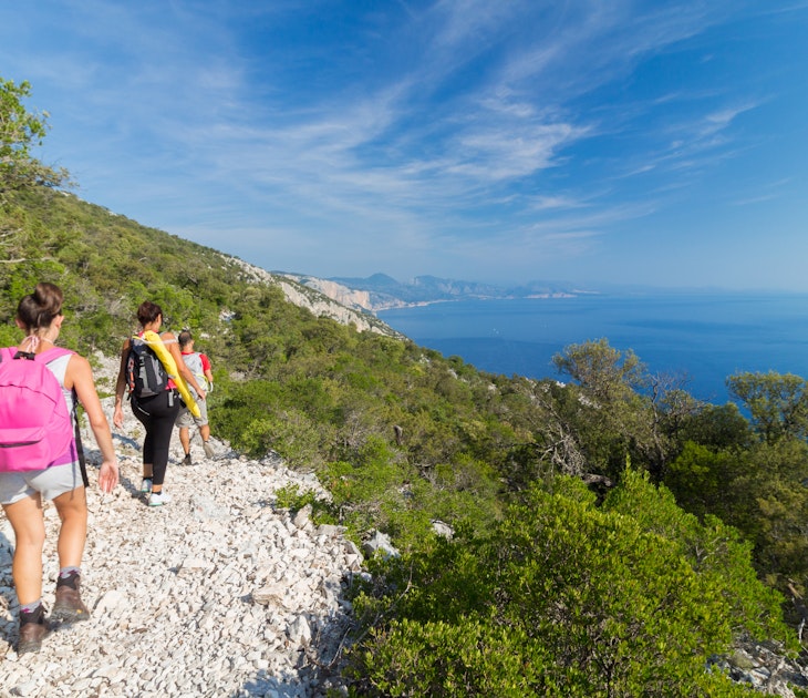 Group of three people doing trekking in the track called "Ispuligi de nie" (inspuligidenie). The road leads to a beautiful beach called "Cala Mariolu" which is an important tourist destination of Sardinia. Peolpe walking and doing sport in an uncontaminated natural landscape. Baunei, Ogliastra, Sardinia, Italy.
538833044
rear view