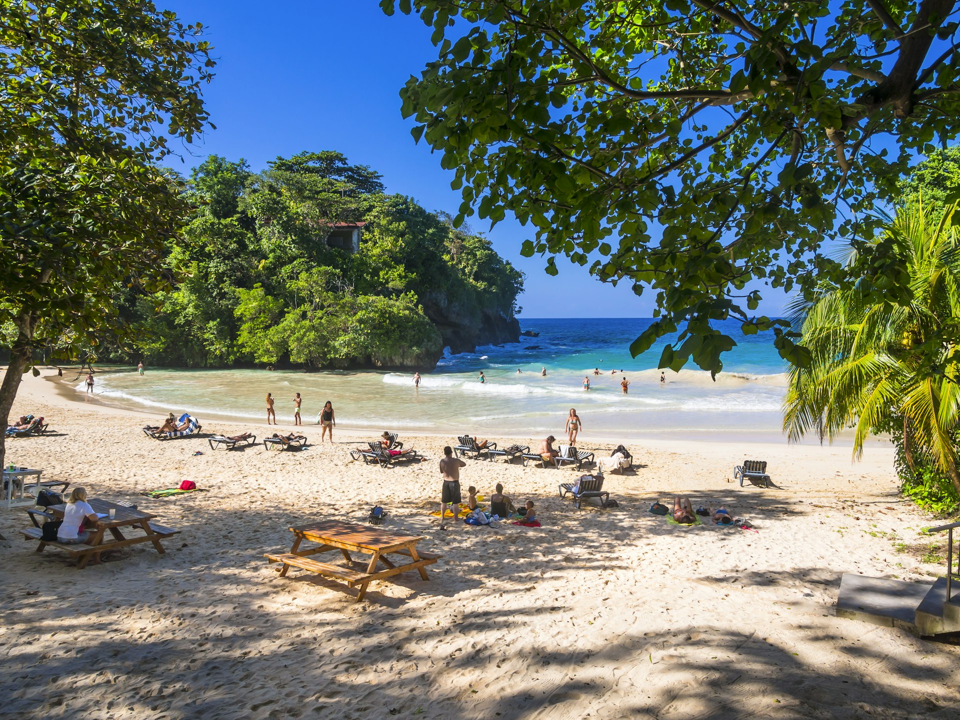 Beachgoers enjoy the sunshine at Frenchman's Cove, Jamaica