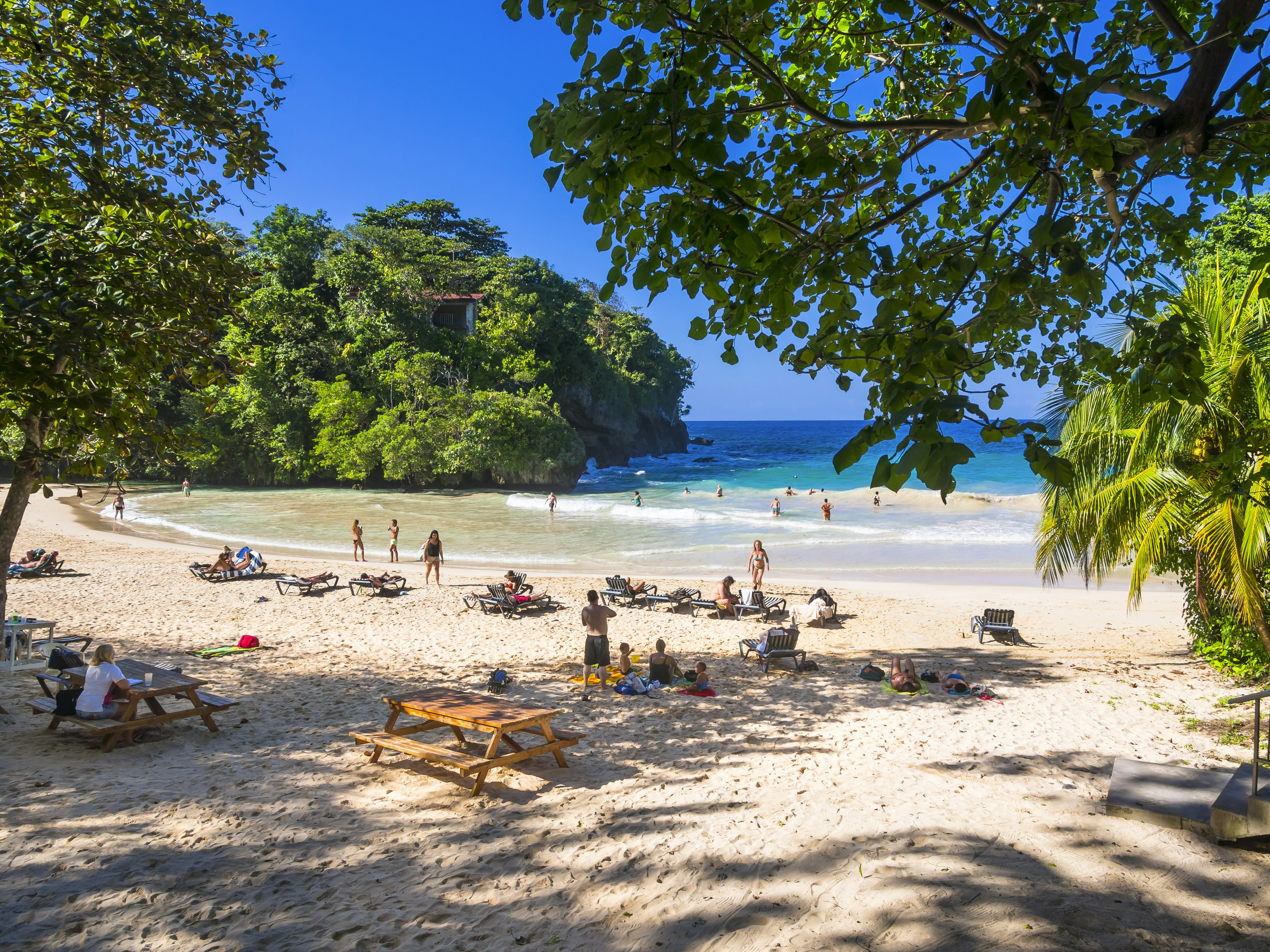 Beachgoers enjoy the sunshine at Frenchman's Cove, Jamaica