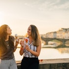 Young Friends Portrait While Eating Ice-Cream
585062158
White Background, Posing, Young Women, Two People, Copy Space, Weekend Activities, Making a Face, Ponte Santa Trinita Bridge, Lens Flare, 25-29 Years, 20-24 Years, 20-29 Years, Young Adult, Smiling, Eating, Fun, Caucasian Ethnicity, Heat - Temperature, Togetherness, Relaxation, Freedom, Joy, Happiness, Humor, Friendship, Food And Drink, Lifestyles, Urban Scene, Looking At Camera, Horizontal, Cheerful, Florence - Italy, Italy, Sunset, Summer, Arno River, River, Bridge - Man Made Structure, City, Ice Cream, Sweet Food, Sunglasses, Spoon, lungarno, Ponte Alla Carraia Bridge, Scoop