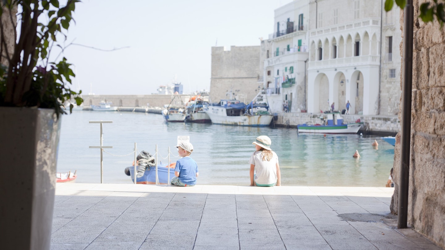 604573185
4 to 5 years, 8 to 9 years, boat, boy, brother, buildings, caucasian ethnicity, child, childhood, day, female, girl, harbor, italian culture, italy, leisure, male, martina franca, monopoli, outdoors, puglia, rear view, sister, sitting, summer, tourism, tourist destination, tourist, travel destination, travel, vacation, water