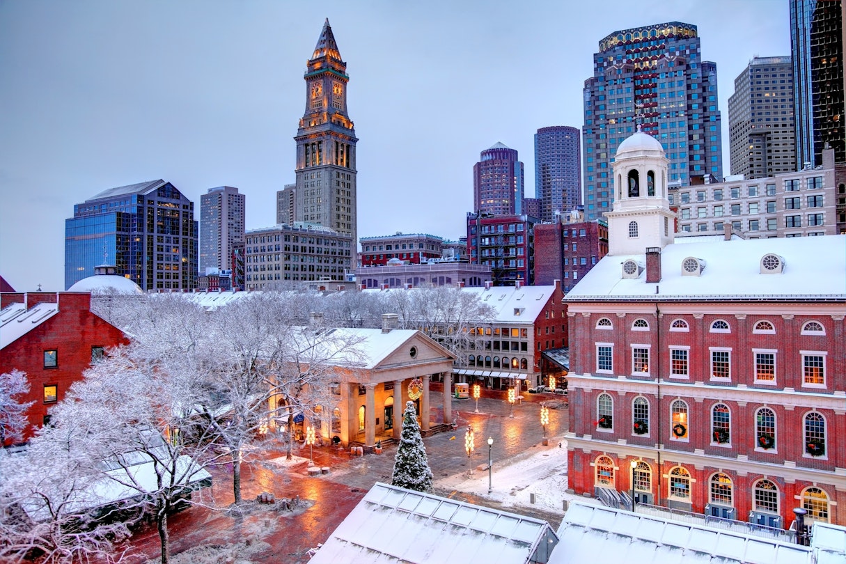 Faneuil Hall rooftops covered in snow during the winter season in Boston. Faneuil Hall Also known as Quincy Market is located near the waterfront and Government Center, in Boston, Massachusetts, has been a marketplace and a meeting hall since 1743.  Boston is the largest city in New England, the capital of the Commonwealth of Massachusetts
887480596