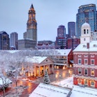 Faneuil Hall rooftops covered in snow during the winter season in Boston. Faneuil Hall Also known as Quincy Market is located near the waterfront and Government Center, in Boston, Massachusetts, has been a marketplace and a meeting hall since 1743.  Boston is the largest city in New England, the capital of the Commonwealth of Massachusetts
887480596