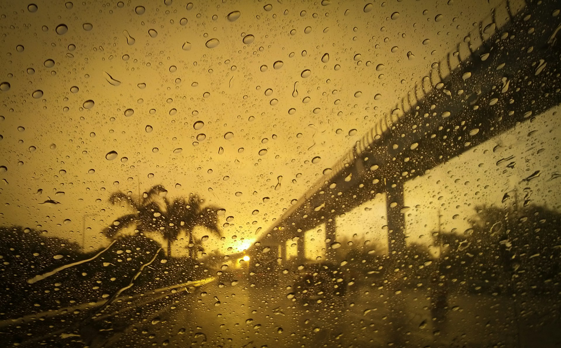 A rainy sky seen through car windshield at sunset, Miami, Florida, USA