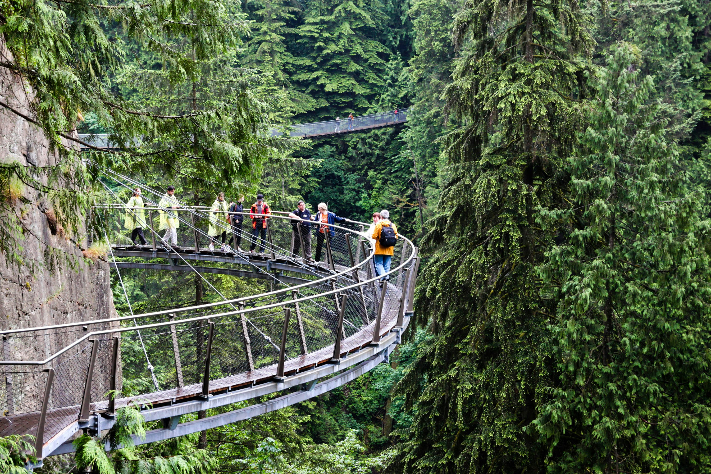 June 29, 2011: Visitors explore the Capilano Cliff Walk through rainforest vegetation. The cantilevered and suspended walkways jut out from the granite cliff face 230 metres above the Capilano River.
510655579
Deep, Hanging, Crossing Bridge, Walking, Tourist, Plant, Granite - Rock, Cliff Walk, Crossing, Anticipation, Travel, Vancouver - Canada, Valley, Bridge, Outdoors, Vancouver, Capilano, Park, Rainforest, Vacations, Forest, Rock, Canada, Adventure, North Vancouver, Woodland, Capilano Park, Suspension Bridge, Horizontal, Scenics - Nature, Bridge - Built Structure, Hill, Cliff, Tree, Suspended Bridge, District Of North Vancouver, Rock - Object, British Columbia, Bridge Crossing, Summer, Photography, Mountain, North America, Public Park, Capilano Suspension Bridge