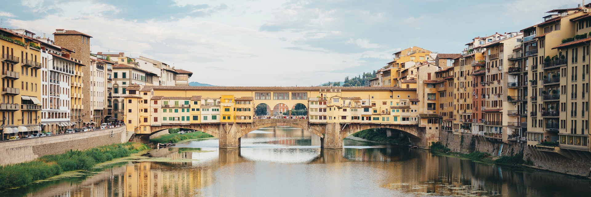 Italy, Florence, River Arno and Ponte Vecchio
591215507
Italy; Incidental People; Water; Water's Edge; Building; City; 2015; Architecture; Bridge - Built Structure; Built Structure; Mode of Transport; Cityscape; History; Travel Destinations; Bridge; Arno; Florence; Tourism; Tuscany; Nautical Vessel; Florence - Italy; Horizontal; Embankment; Ponte Vecchio; International Landmark; River; Day; Riverside; Photography; Cloud - Sky; Sky; Famous Place; Travel; Outdoors; Color Image; City Break;