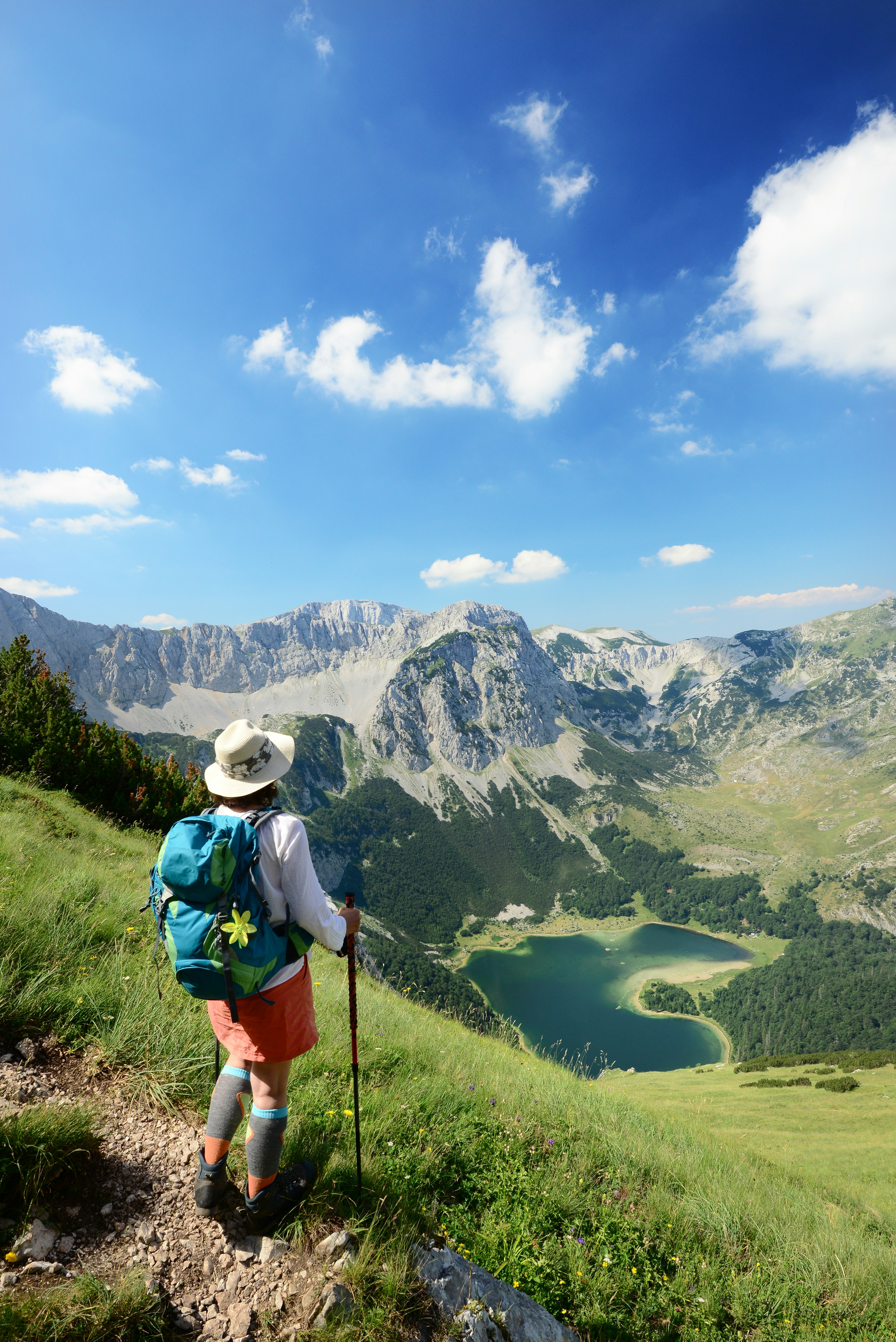 A hiker looking down on Trnovačko Lake, Montenegro