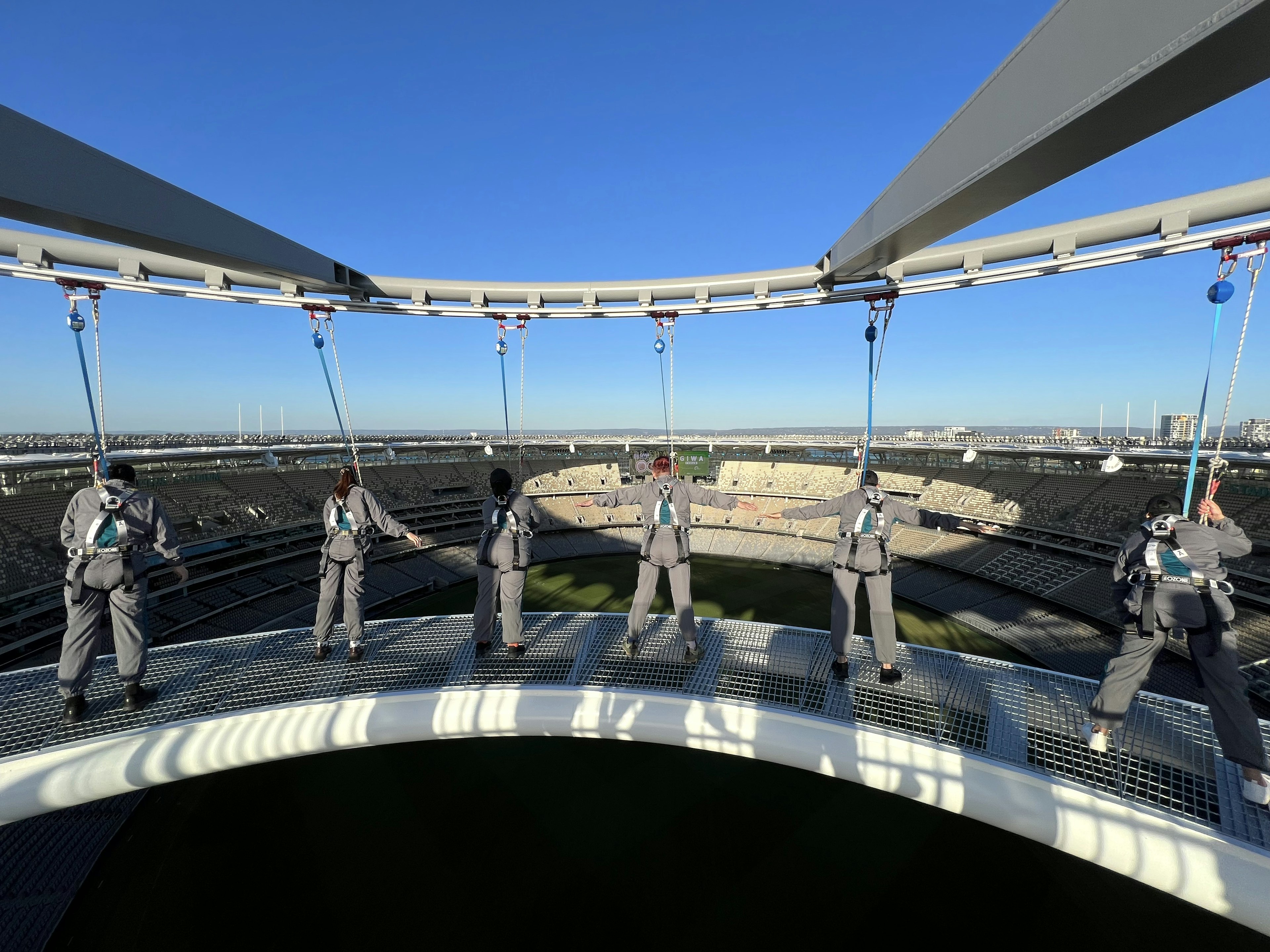 People in harnesses at Optus Stadium in Perth