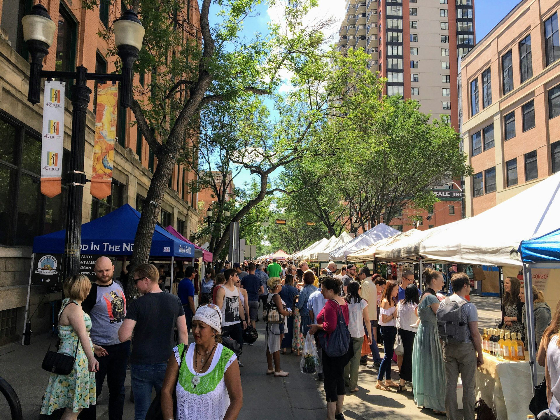 The local farmers market in downtown Edmonton, Alberta, Canada is busy with locals and tourists looking to buy fresh local food and designed clothes.