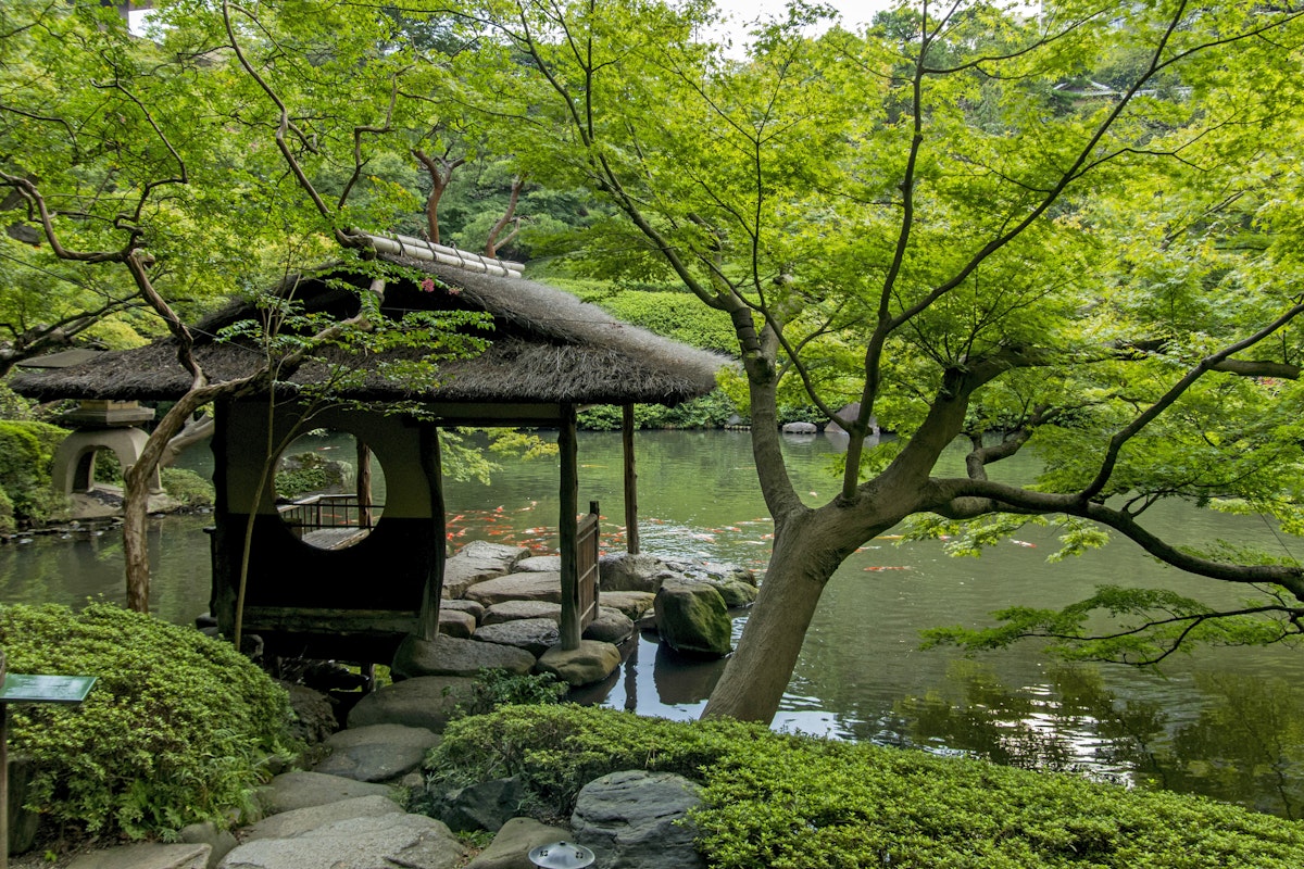 Tokyo, Japan - September 12, 2014: Resting house at the Happo-en Garden in Tokyo. The garden is a beautiful exapmple of Japanese zen-style gardening with restaurant and teahouse facilities.
473136868
Ornamental Garden, Stone - Object, Environmental Conservation, Seat, Silence, Zen-like, East Asian Culture, Bark, Stone Material, Cabin, Walking, Relaxation, Tranquil Scene, Circle, Green Color, Wood - Material, Japanese Culture, Wet, Tropical Climate, Nature, Minato Ward, Tokyo Prefecture, Japan, Leaf, Branch, Tree, Moss, Fish, Forest, Pond, Lake, Wave, Architectural Column, Window, Footpath, Formal Garden, Park - Man Made Space, Happo-en