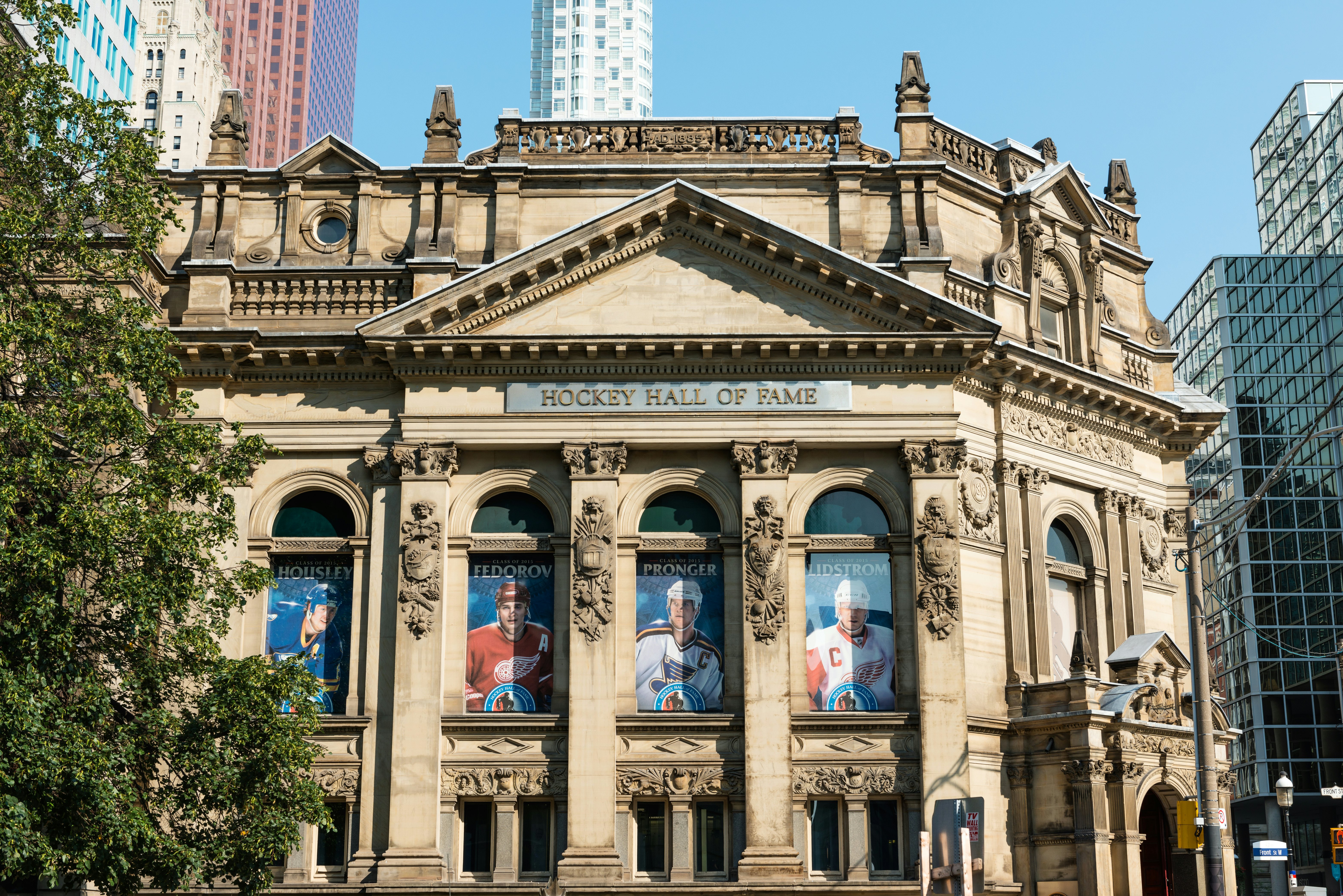 Toronto, Canada - September 5, 2015: Front facade of the Hockey Hall of Fame in Toronto, Ontario, a building dedicated to the history of ice hockey and home to the Stanley Cup.
493697002
National Hockey League, Front Street, Stanley Cup, City Life, Fame, Collection, Downtown District, Souvenir, Exhibition, Facade, Art Museum, Skyscraper, Sidewalk, Canadian Culture, History, Blue, International Landmark, Famous Place, Architecture, Sport, Wide Angle, Urban Scene, Ice Hockey, Sports Team, Toronto, Ontario - Canada, Canada, North America, Summer, Trophy, Bank, Museum, Street, Avenue, Tower, Built Structure, Financial District, City, Cup, Hall Of Fame, Hockey Hall Of Fame