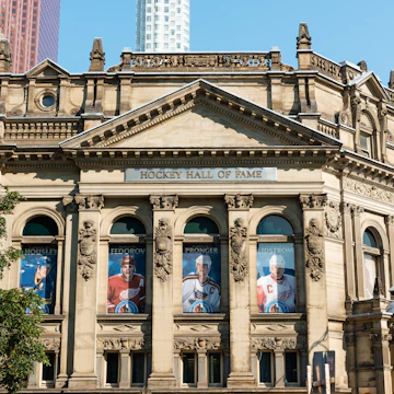 Toronto, Canada - September 5, 2015: Front facade of the Hockey Hall of Fame in Toronto, Ontario, a building dedicated to the history of ice hockey and home to the Stanley Cup.
493697002
National Hockey League, Front Street, Stanley Cup, City Life, Fame, Collection, Downtown District, Souvenir, Exhibition, Facade, Art Museum, Skyscraper, Sidewalk, Canadian Culture, History, Blue, International Landmark, Famous Place, Architecture, Sport, Wide Angle, Urban Scene, Ice Hockey, Sports Team, Toronto, Ontario - Canada, Canada, North America, Summer, Trophy, Bank, Museum, Street, Avenue, Tower, Built Structure, Financial District, City, Cup, Hall Of Fame, Hockey Hall Of Fame