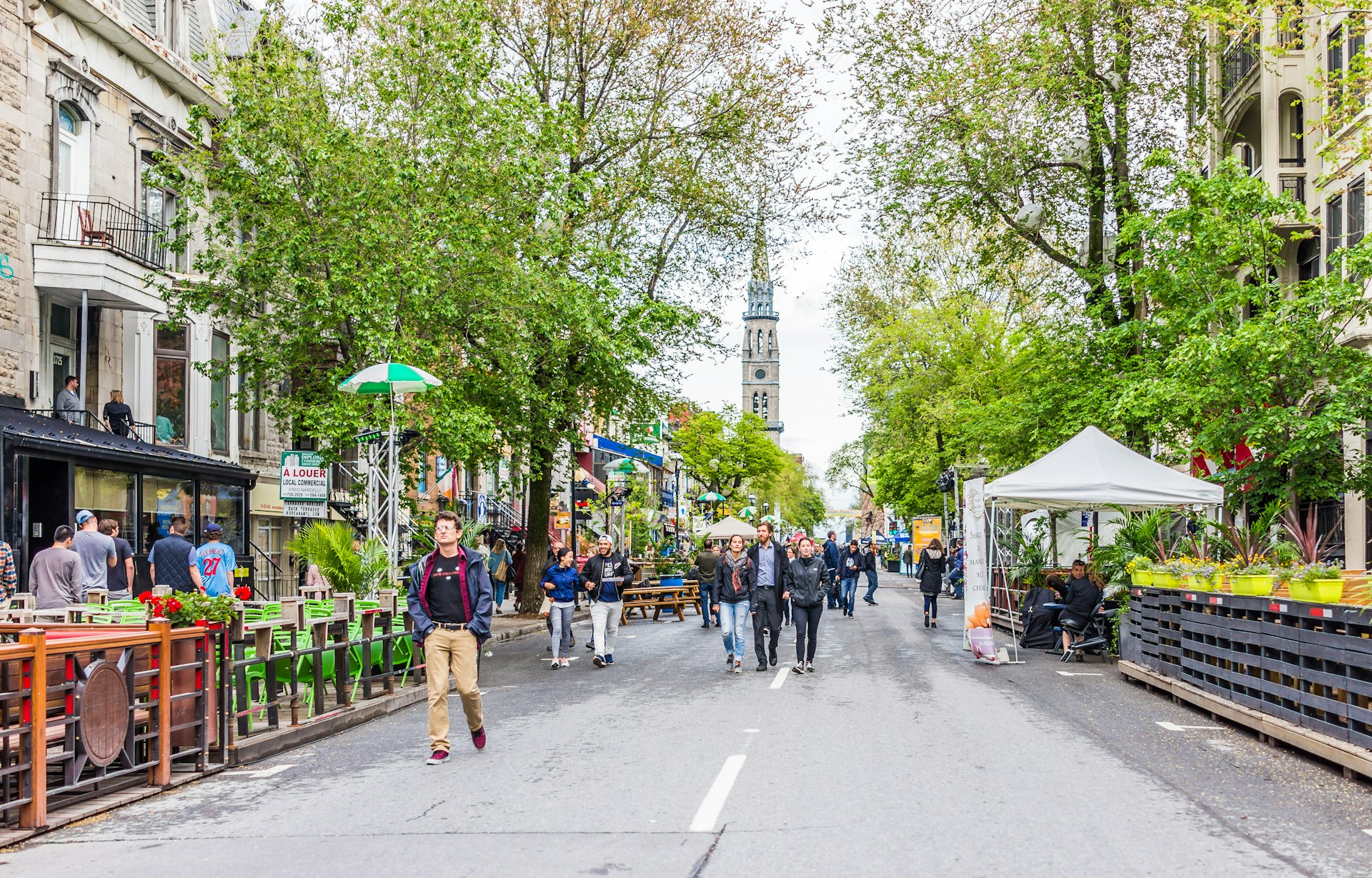 People walking on Saint Denis street in Montreal's Plateau Mont Royal in Quebec region.