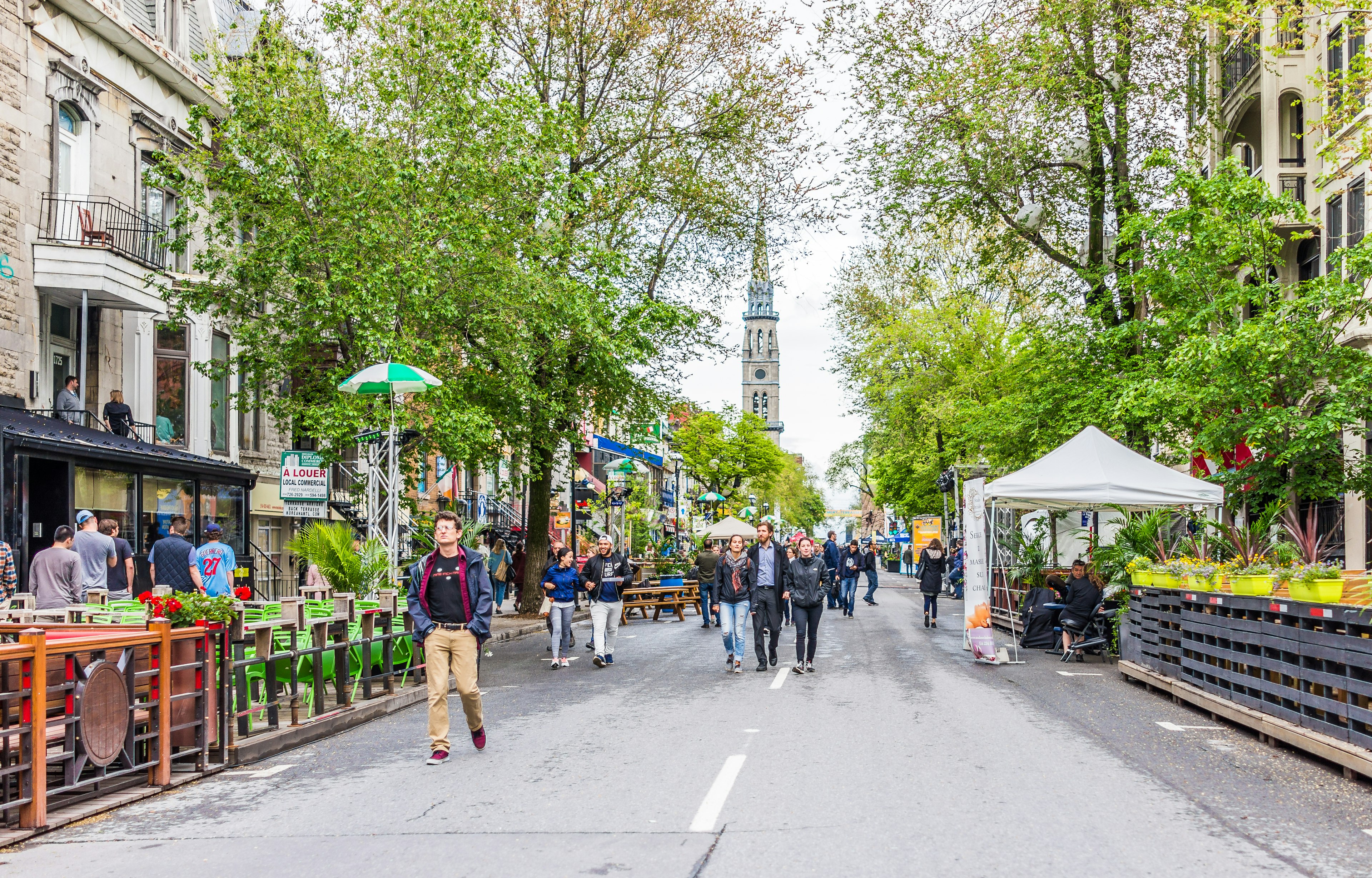 People walking on Saint Denis street in Montreal's Plateau Mont Royal in Quebec region.