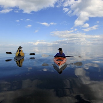 Biscayne National Park, Florida - 01/25/2014: Kayakers enjoy an exceptionally calm day in Biscayne Bay off Black Point, just south of Miami with a horizon difficult to distinguish in the clouds.; Shutterstock ID 1213832035; GL: 65050; netsuite: Lonely Planet Online Editorial; full: Best national parks in Florida; name: Brian Healy
1213832035
bay, biscayne bay, biscayne national park, black point, cloud, cloud reflection, clouds, clouds sky, environment, florida, glossy water, horizon, indistinct horizon, kayak, kayaker, kayakers, kayaking, miami, national park, nature, outdoor, outside, placid, recreation, reflection, reflection in water, reflections, reflections in water, sea, serenity, sky, sport, tranquil, tranquil water, tranquility, uncrowded, unspoiled, watercraft