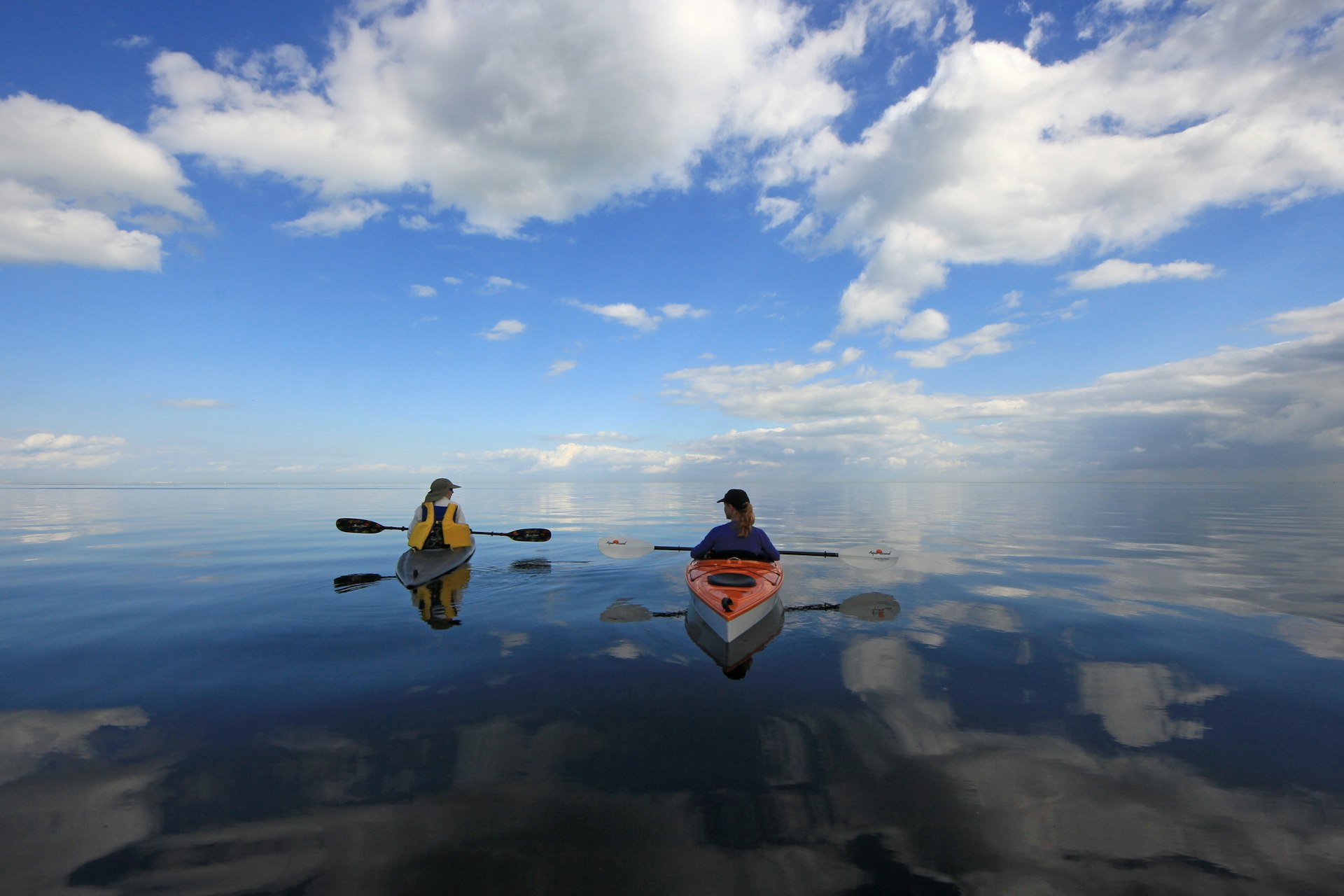 Kayakers enjoy an exceptionally calm day in Biscayne Bay off Black Point, Biscayne National Park, Florida, USA