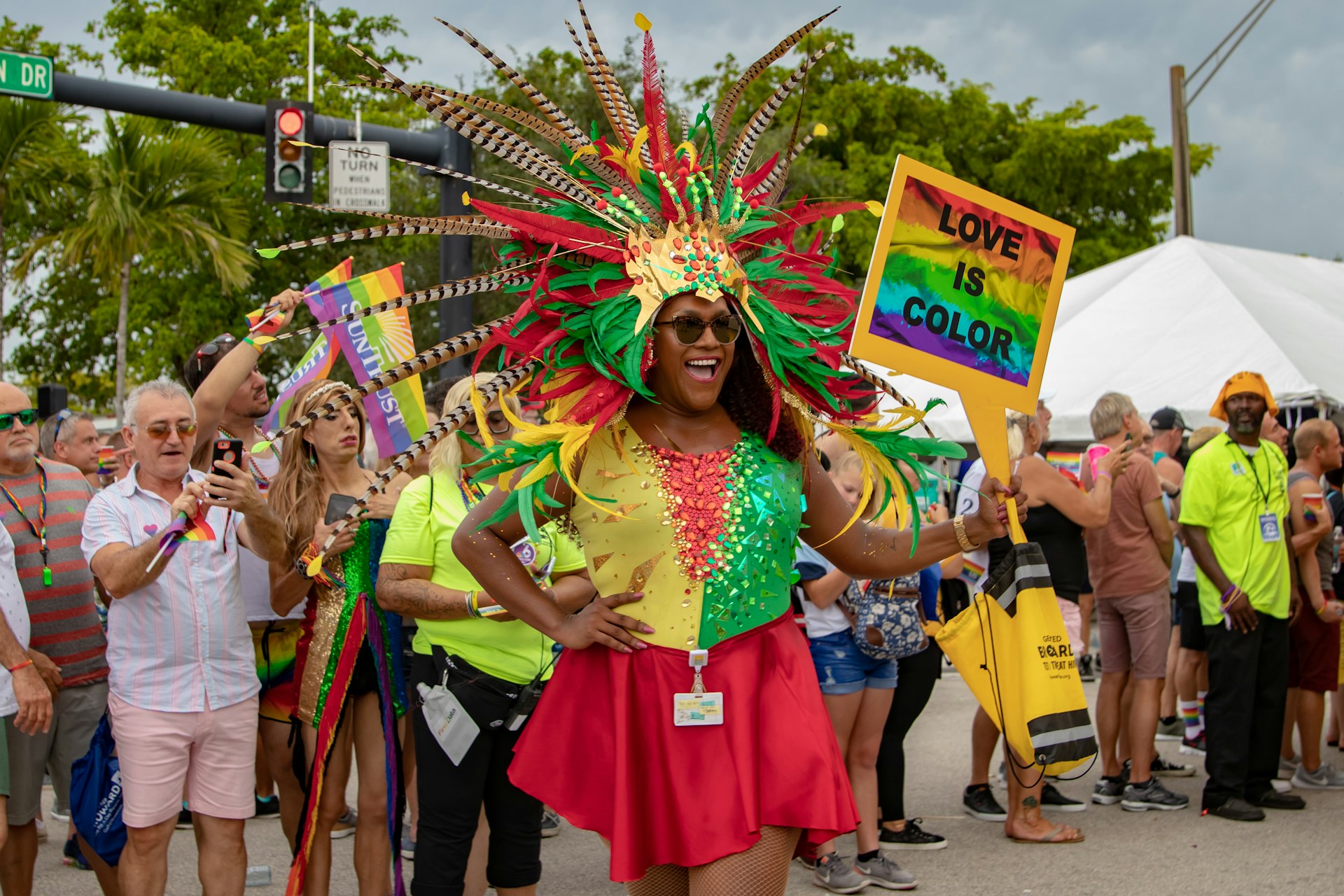 A woman in a bright, feathered costume at the Stonewall Pride Parade, Wilton Manors, Florida, USA