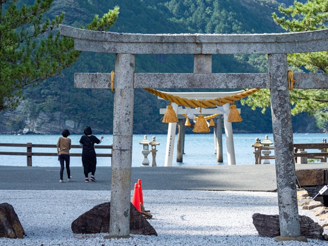 People at the torii at Watazumi Shrine, Tsushima, Nagasaki Prefecture, Japan