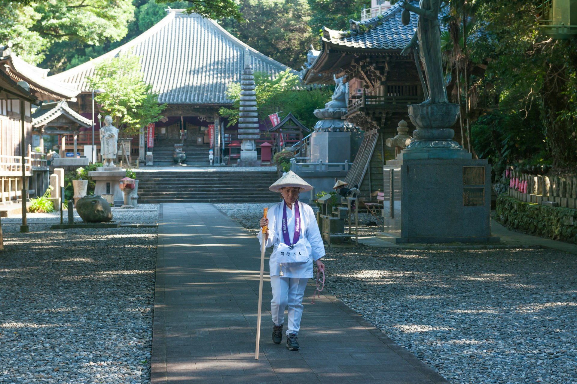 A pilgrim wearing white taking on the 88 Temple Pilgrimage, Shikoku, Japan