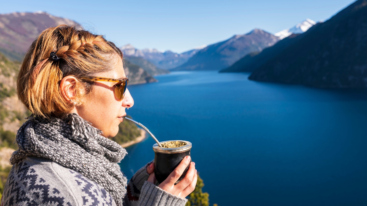 Beautiful young woman contemplating the landscape and enjoying some delicious sweet mates in the lakes and mountains of southern Argentina.; Shutterstock ID 2158935565; GL: 65050; netsuite: Online editorial; full: Argentina mate drink; name: Claire naylor
2158935565