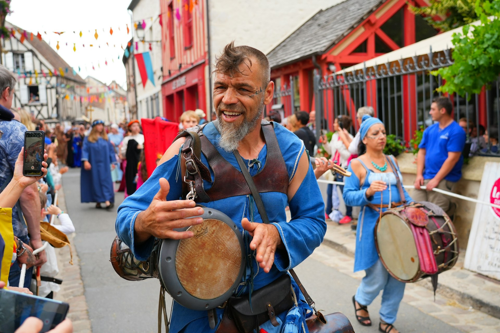  Group of musicians playing djembe in the streets at the "Médiévales de Provins" medieval fair in the UNESCO World Heritage town of Provins