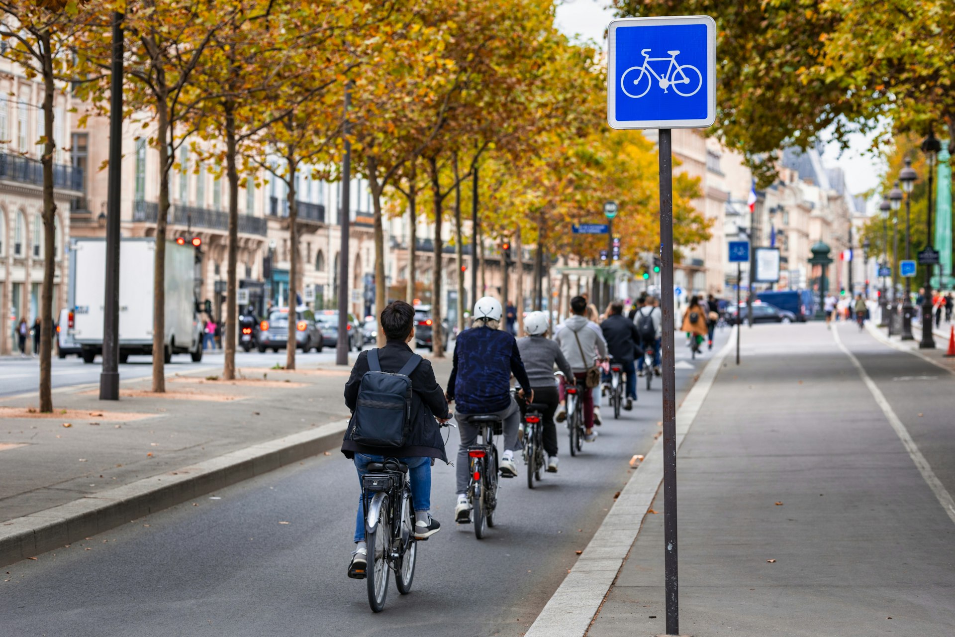 Cyclists on the bike path along the Seine in Paris. 