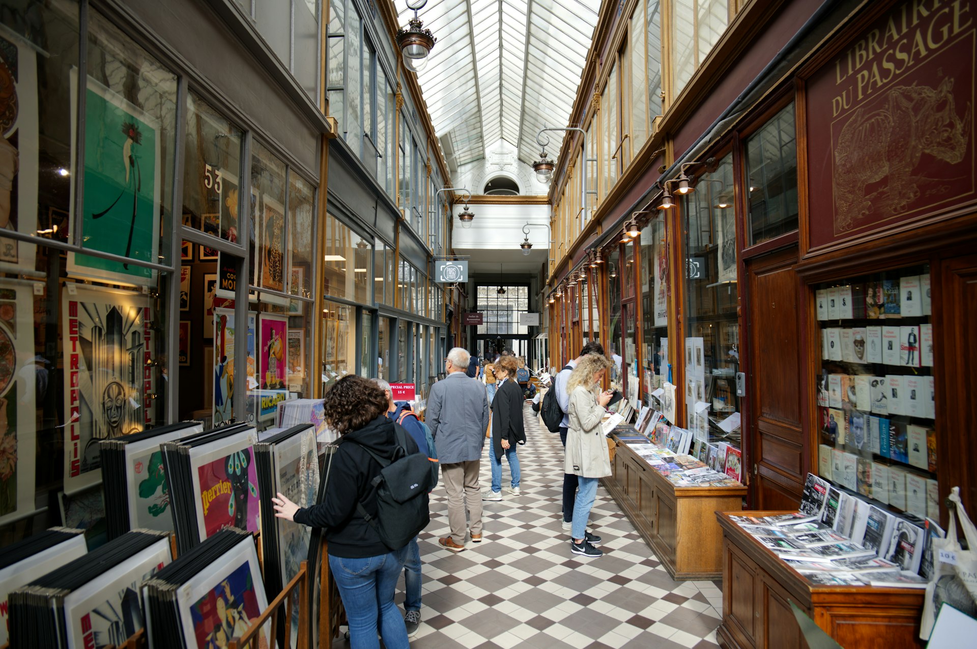 People browsing shops in Passage des Panoramas, Paris