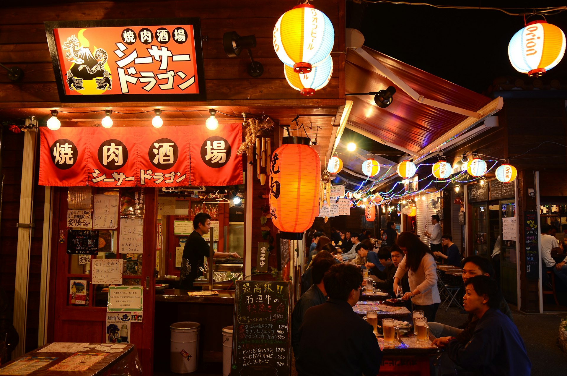 People ordering at a Yatai Street food vendor in Japan