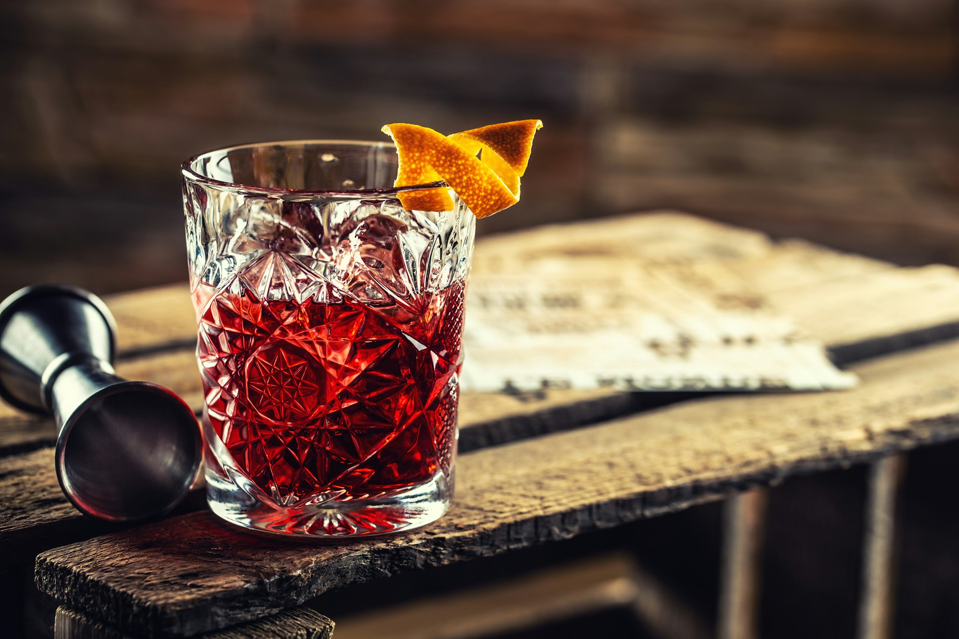Negroni cocktail on an old wooden board.