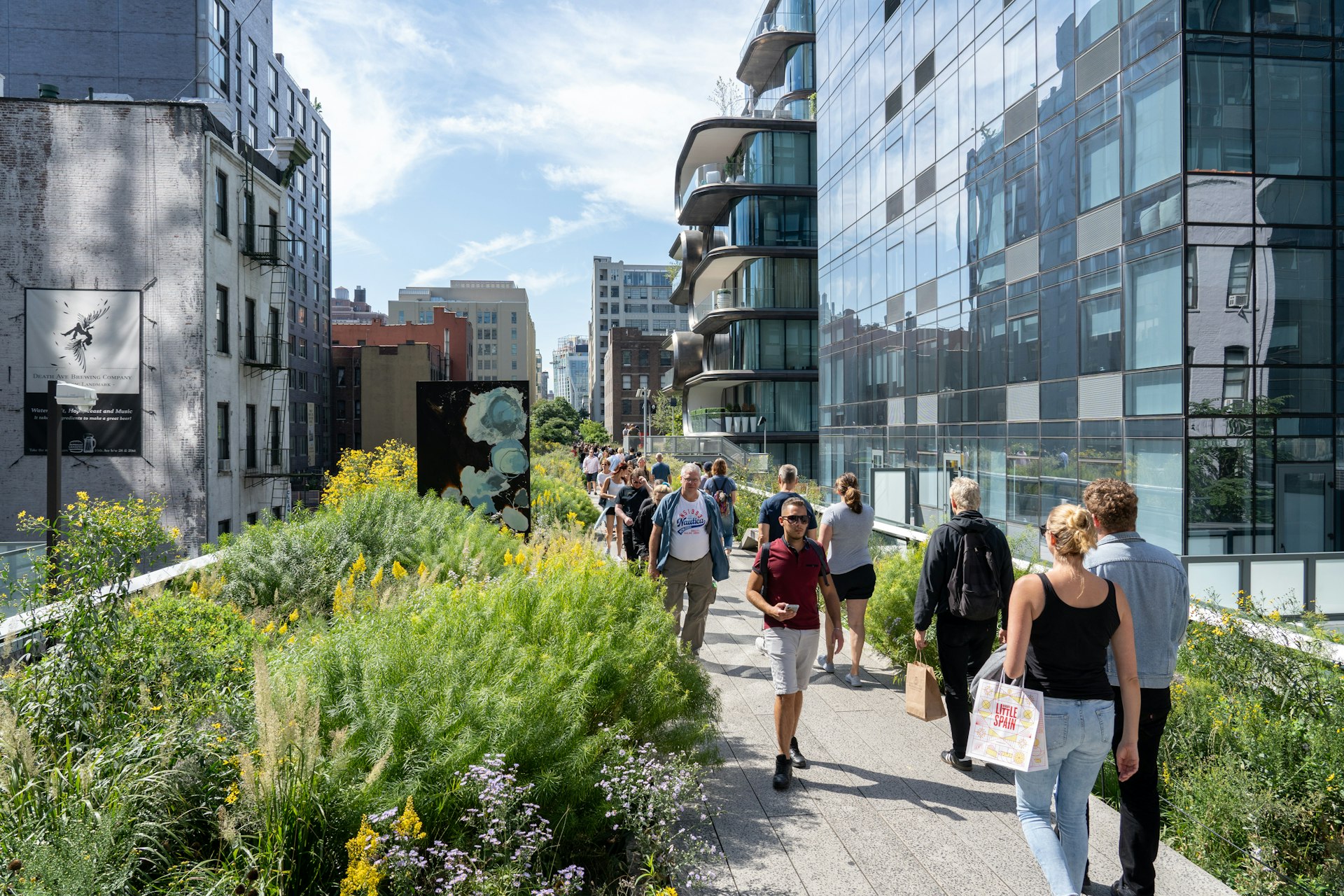 Visitors stroll along the High Line Park in Manhattan