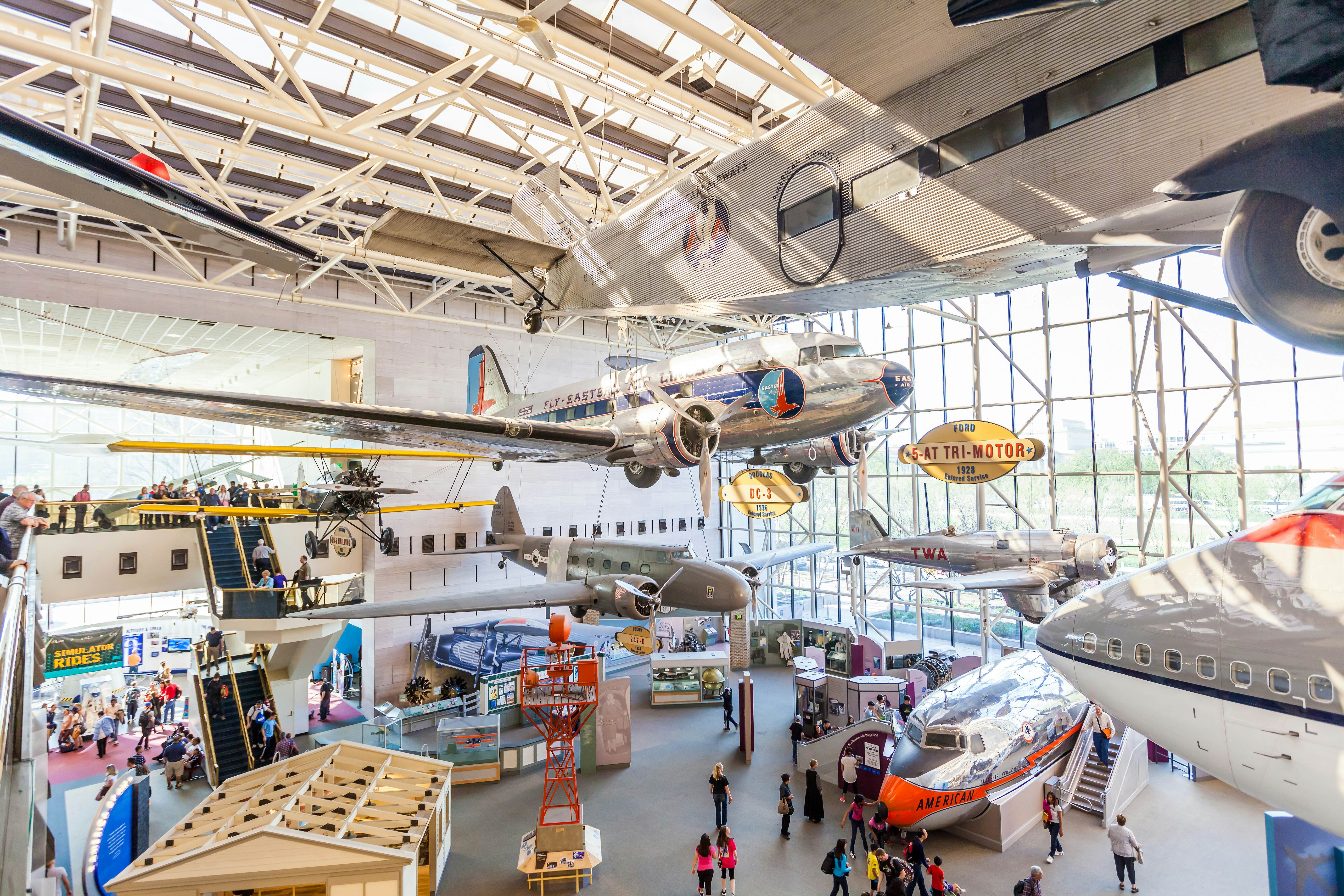 Visitors examining aircraft inside the Smithsonian National Air and Space Museum in Washington, DC.