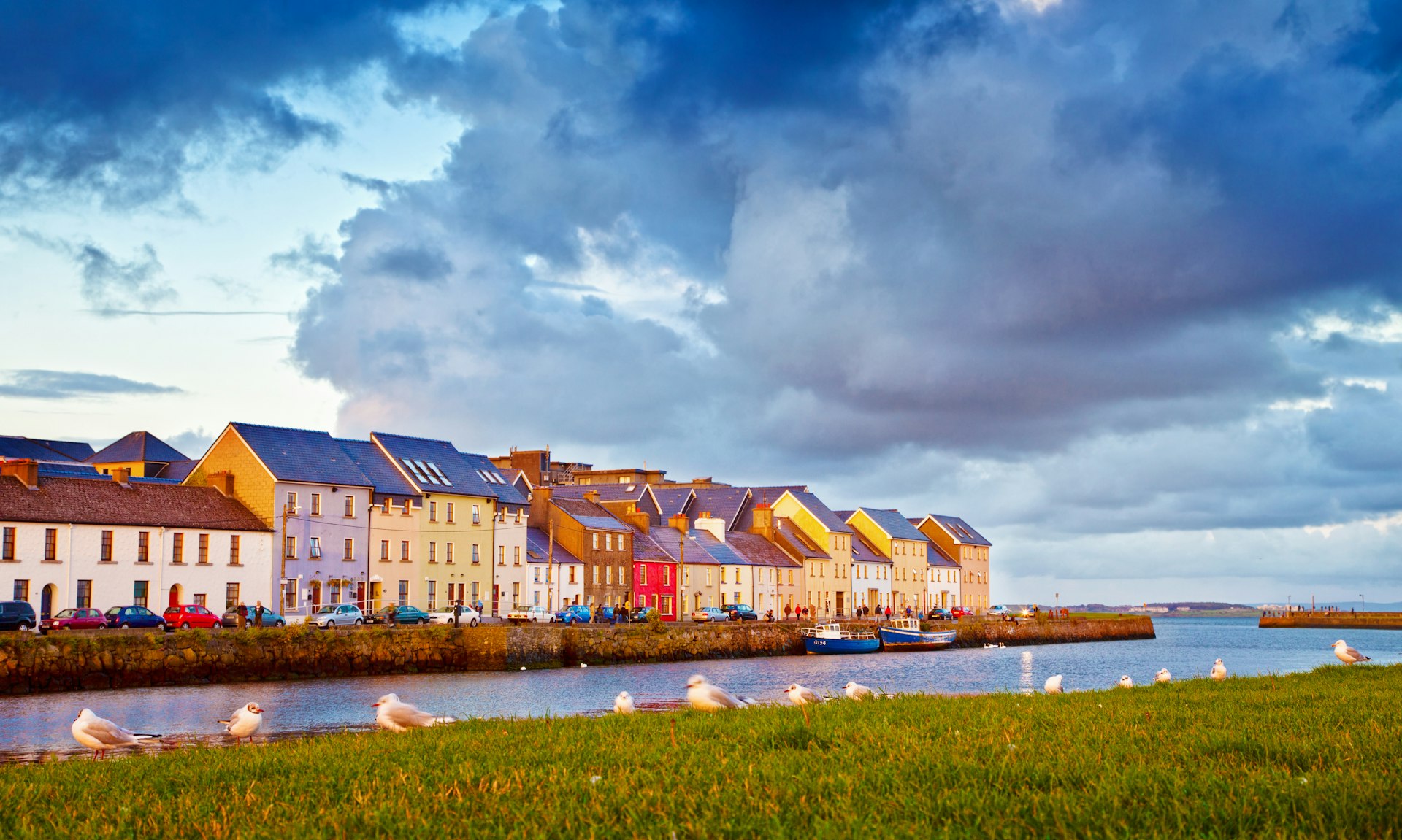 Late evening sunlight on colourful waterfront houses in Galway City.