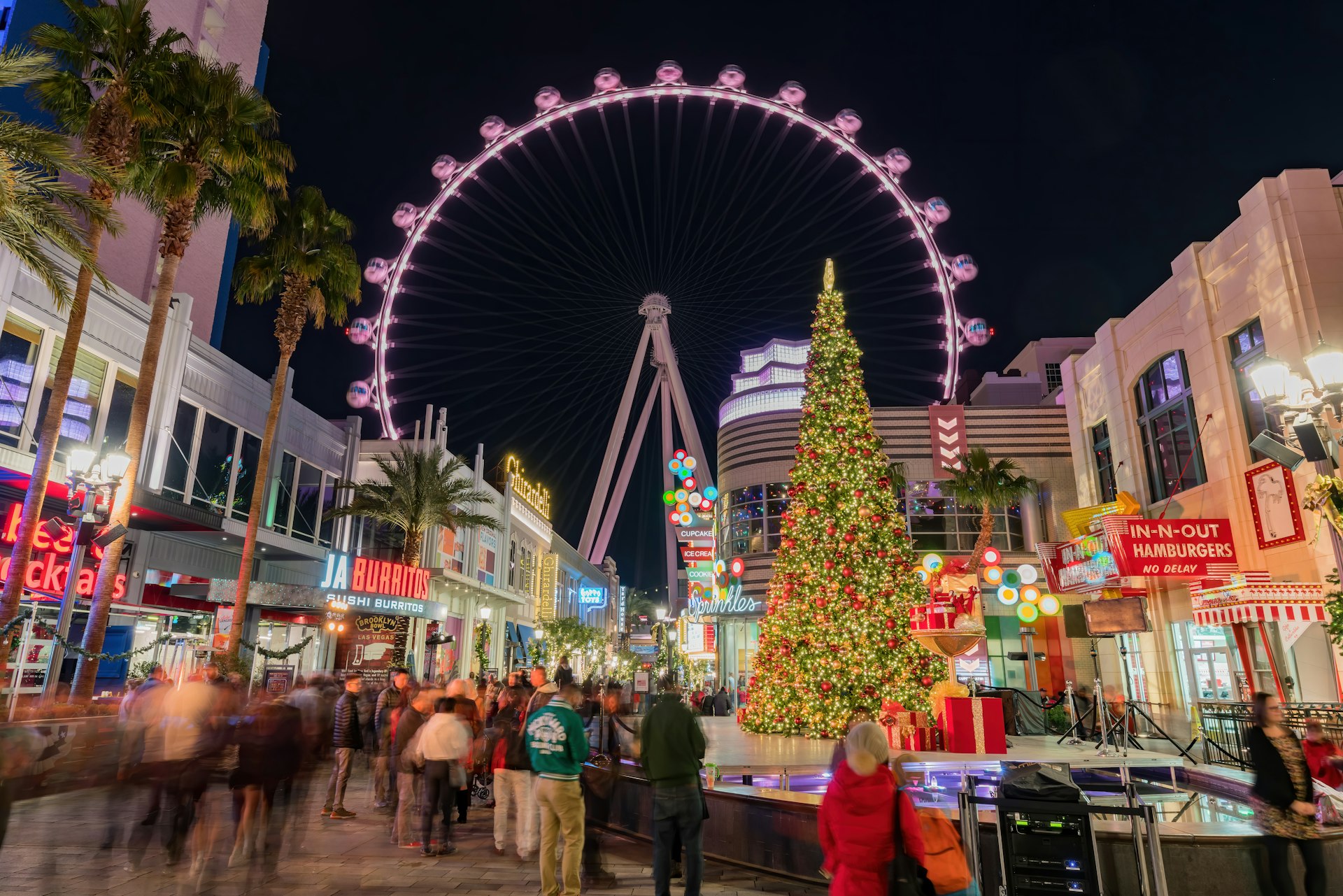 Night view of the Linq Ferris Wheel and a Christmas tree in Las Vegas