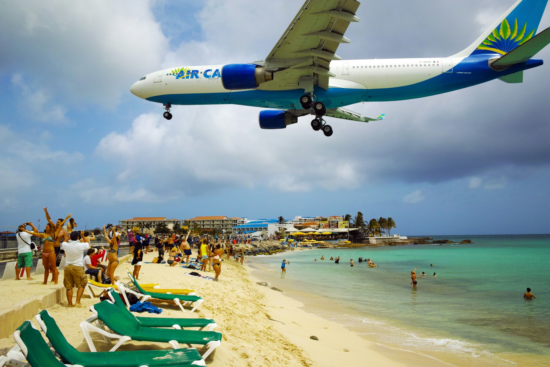Plane flying low over the beach in Sint Maarten