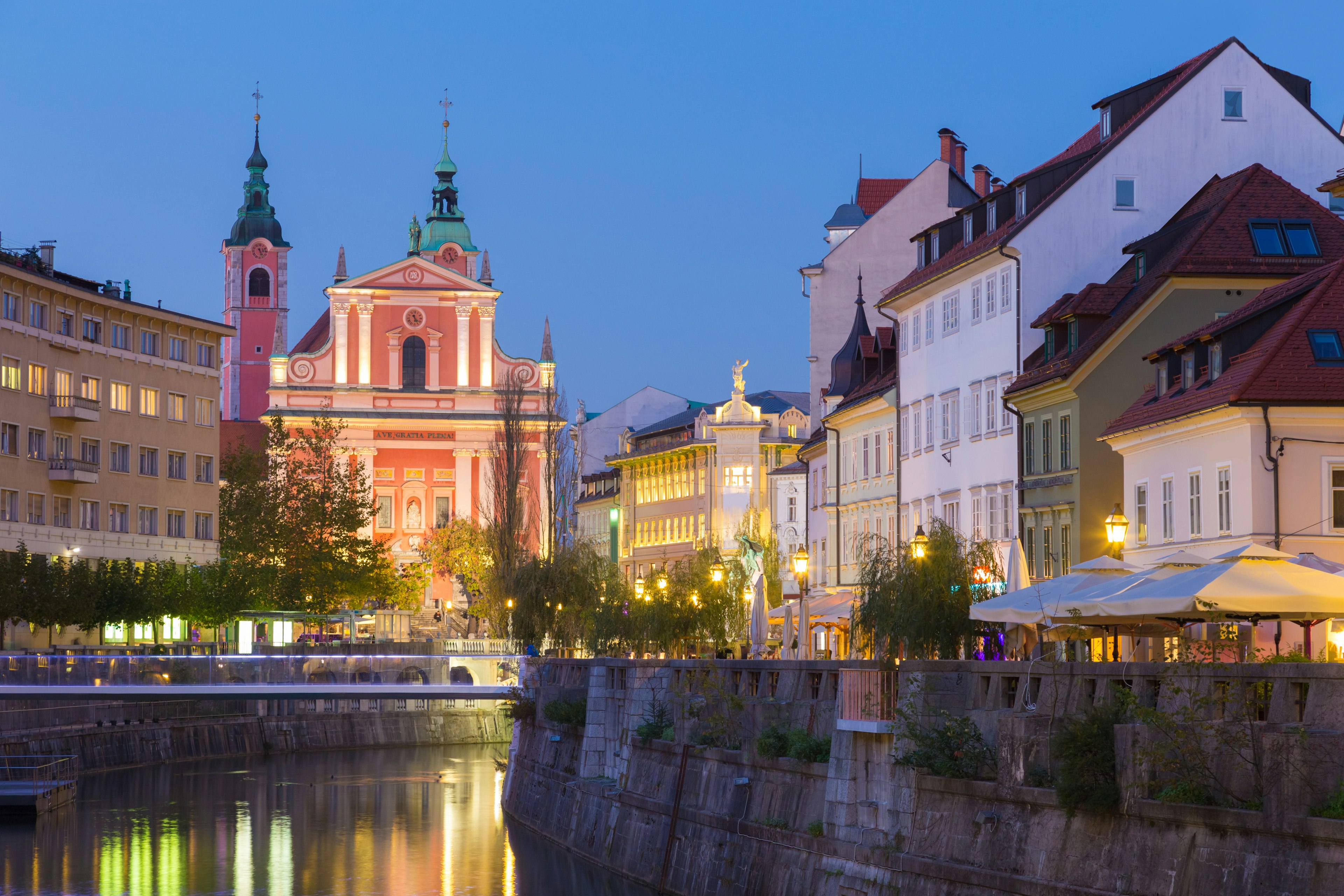 A river in the center of a low-rise European city