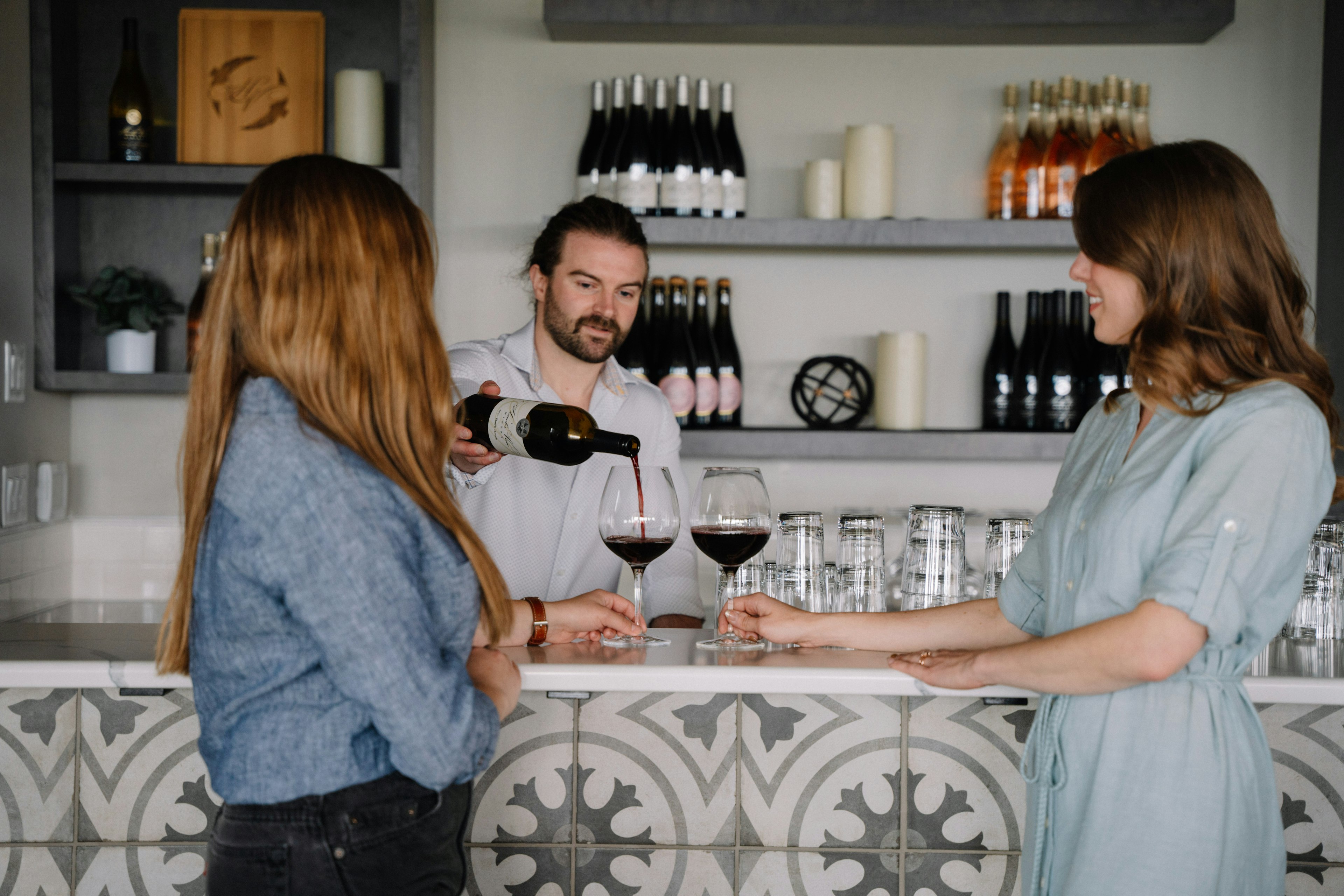 People tasting wine at Hawk’s View Winery