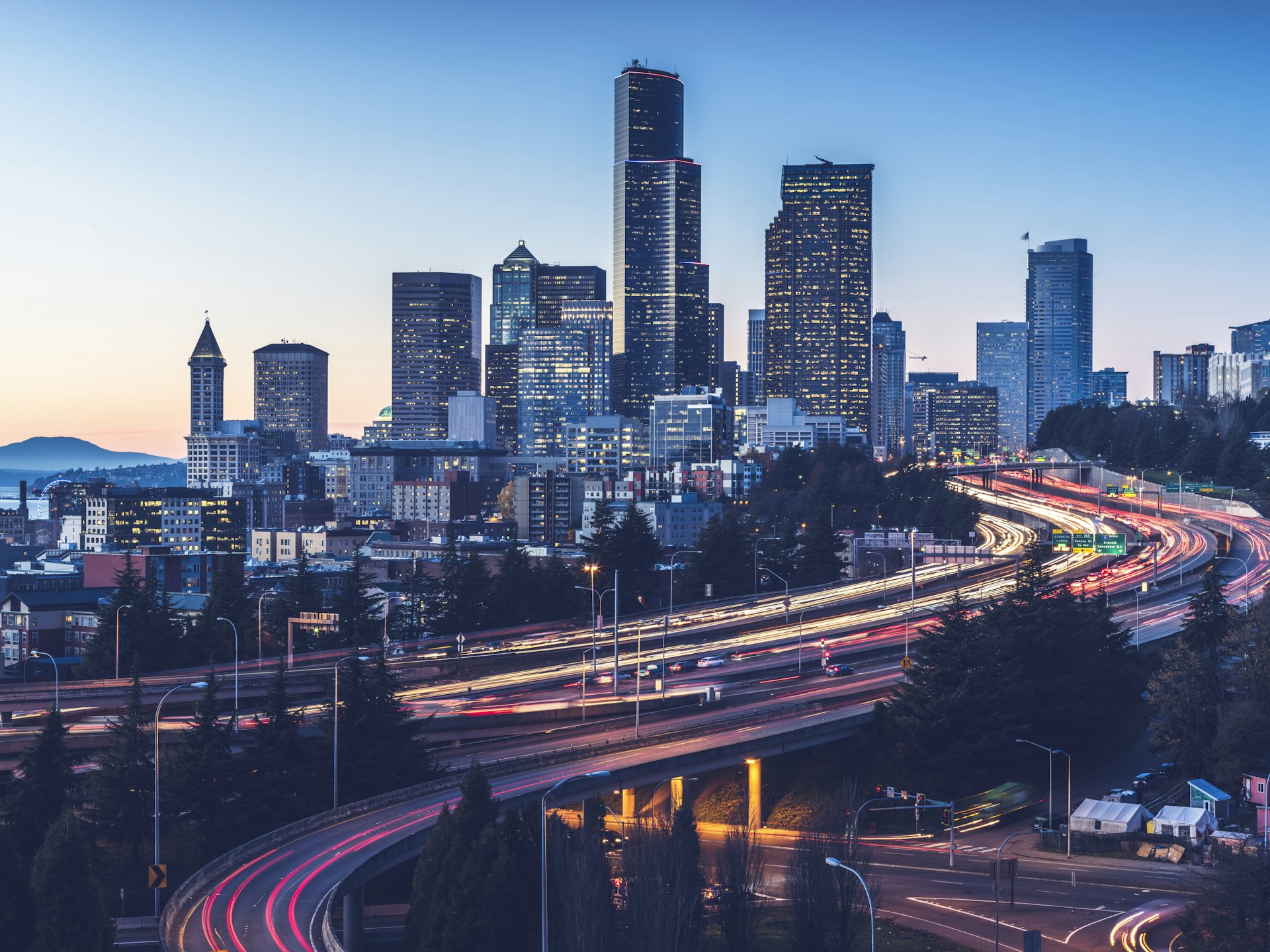Long exposure of Interstate 5 and Seattle downtown skyline at dusk